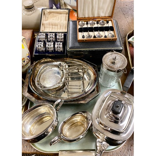 250 - Tray of silver plated items to include teapot, cutlery, toast rack, etc