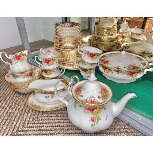 135 - Large quantity of Royal Albert Country Roses dinner ware including tea pot, ashets, tureen, plates, ... 