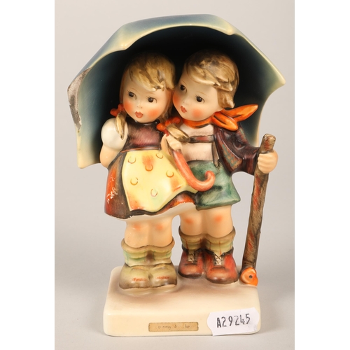 174 - Hummel figure of boy and girl with umbrella, 16 cm high