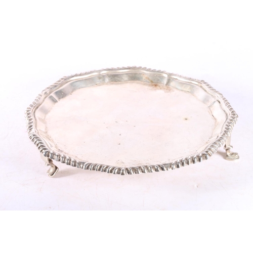 44 - Edwardian silver salver raised on three squat feet, London 1903, 338g.