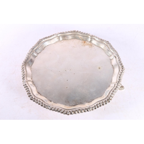 44 - Edwardian silver salver raised on three squat feet, London 1903, 338g.