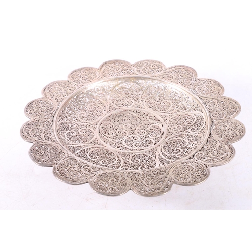 51 - Eastern white metal bowl of lobed circular form with all over filigree decoration, 20cm diameter.