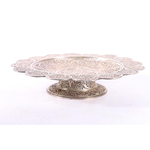 51 - Eastern white metal bowl of lobed circular form with all over filigree decoration, 20cm diameter.