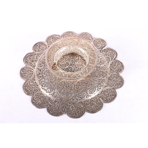 51 - Eastern white metal bowl of lobed circular form with all over filigree decoration, 20cm diameter.