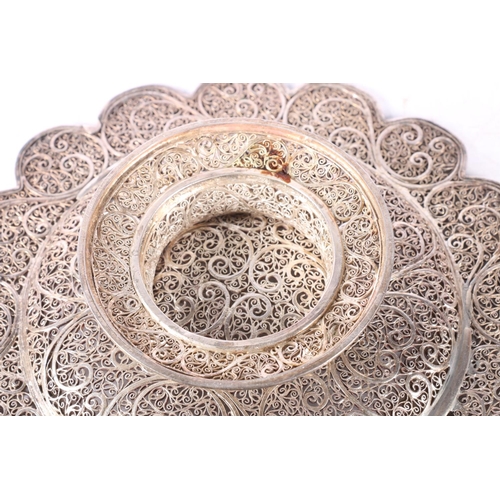 51 - Eastern white metal bowl of lobed circular form with all over filigree decoration, 20cm diameter.