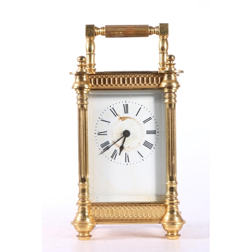 58 - French gilded brass carriage clock, the white enamel dial with Roman numerals, 16cm tall.