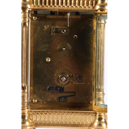 58 - French gilded brass carriage clock, the white enamel dial with Roman numerals, 16cm tall.