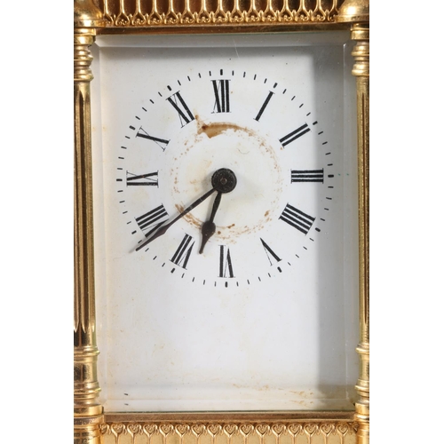 58 - French gilded brass carriage clock, the white enamel dial with Roman numerals, 16cm tall.