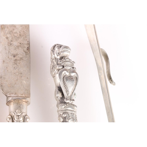 62 - Silver plated flatware to include a pair of serving spoons, carvers, grape scissors, Two George VI C... 