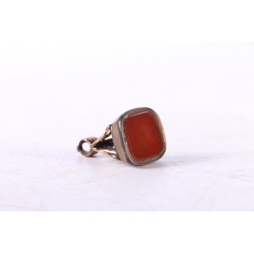 65 - Yellow metal seal fob inset with uncarved carnelian and a pair of Canadain cufflinks.