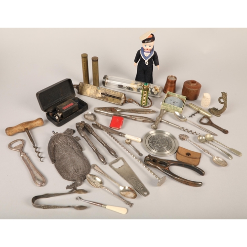 214 - Collection of curios to include sailor's doll, nut crackers, mesh purse, balance scales, etc