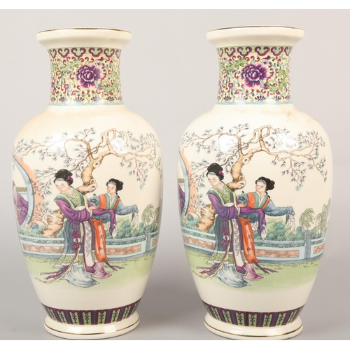 228 - Pair of Oriental baluster vases decorated with figures, 37cm height