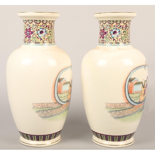 228 - Pair of Oriental baluster vases decorated with figures, 37cm height