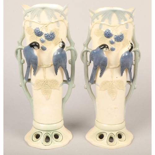 305 - Pair of twin-handled vases with floral & bird design in relief, 30cm height