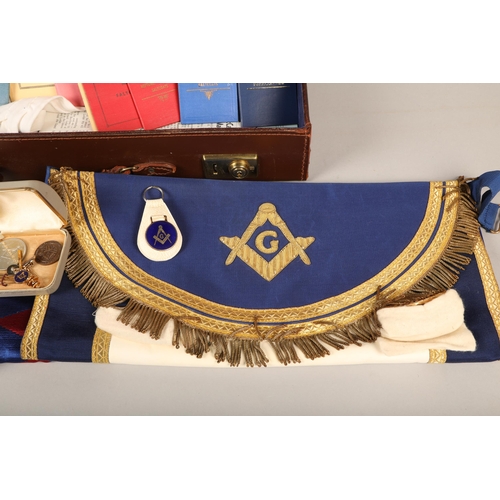 389 - Briefcase containing a variety of Masonic ephemera such as cufflinks, sashes, pamphlets, etc