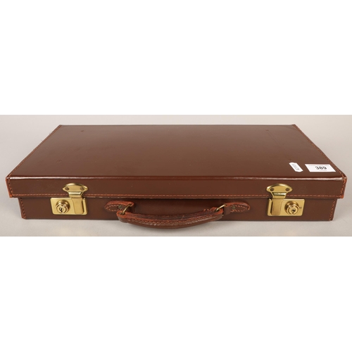 389 - Briefcase containing a variety of Masonic ephemera such as cufflinks, sashes, pamphlets, etc