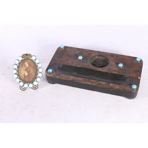 108 - Antique wooden deskstand inset with six turquoise cabochons, 19cm long, and a small easel frame set ... 