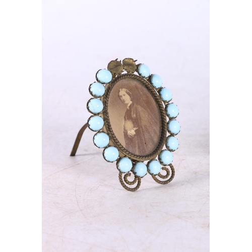 108 - Antique wooden deskstand inset with six turquoise cabochons, 19cm long, and a small easel frame set ... 