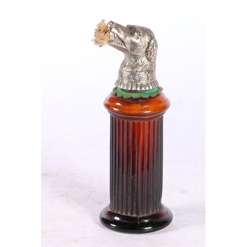 109 - Continental moulded brown glass perfume holder, the cover modelled as a dogs head with wick protrudi... 