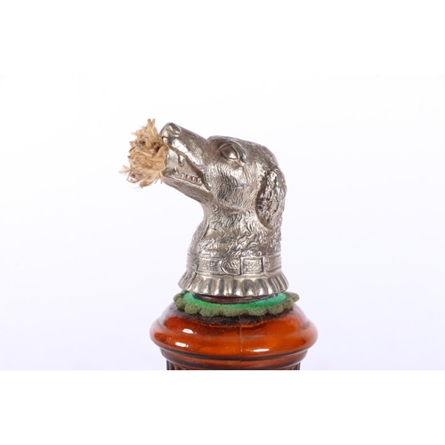 109 - Continental moulded brown glass perfume holder, the cover modelled as a dogs head with wick protrudi... 