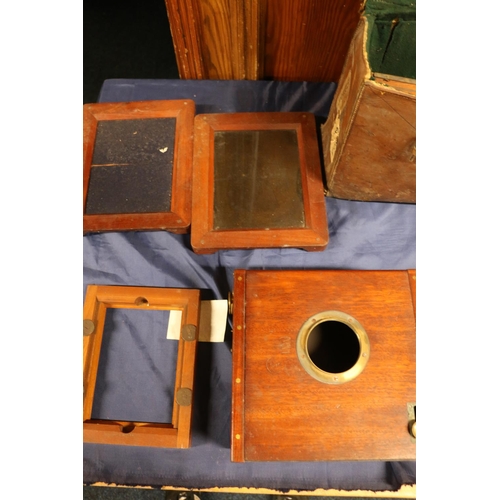 29 - Early 20th century mahogany and brass plate camera (without lens), with accessories in large leather... 