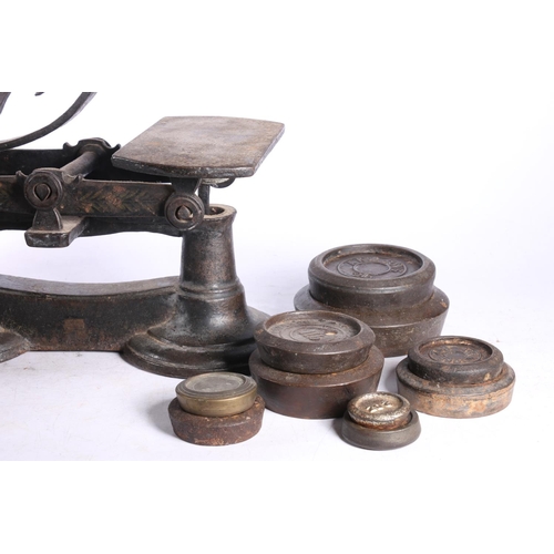 33 - Cast iron balance scales with copper bowl and weights by Crane of Wolverhampton, A K & Sons and ... 