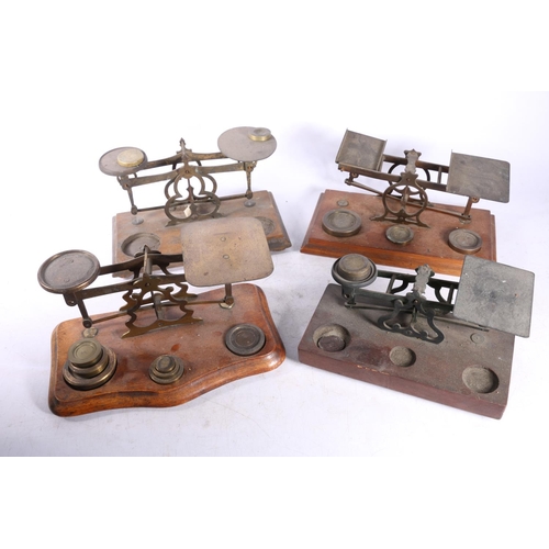 74 - Four sets of postal scales with weights. (4)