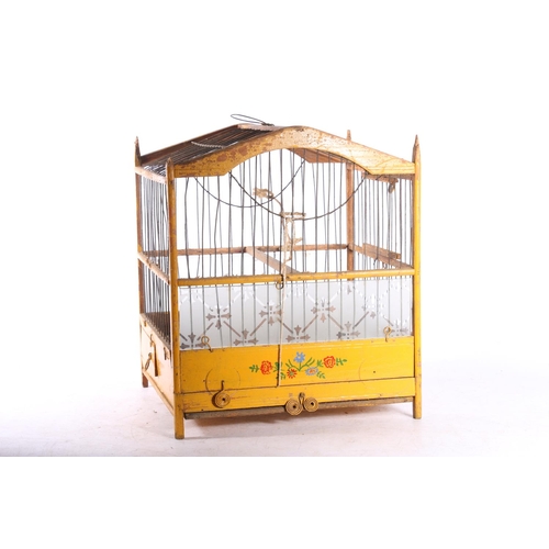 79 - Eastern European painted wooden birds cage, 29cm tall.