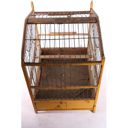 79 - Eastern European painted wooden birds cage, 29cm tall.