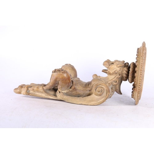 90 - Eastern carved wood wall sconce modelled with anthropomorphic creature support, 33cm tall.