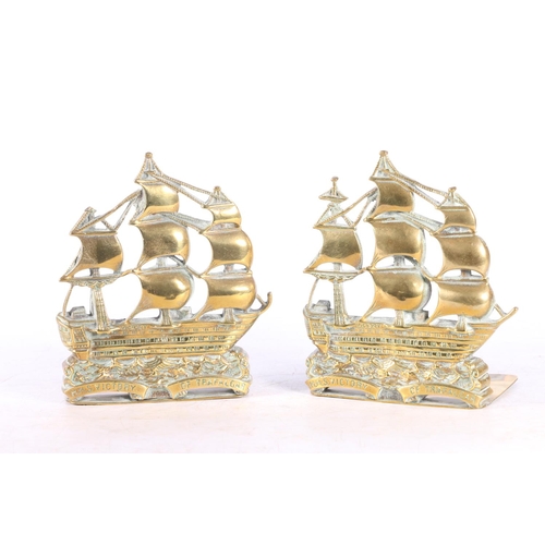 97 - Pair of pierced brass bookends modelled as the ship HMS Victory, 15cm tall.