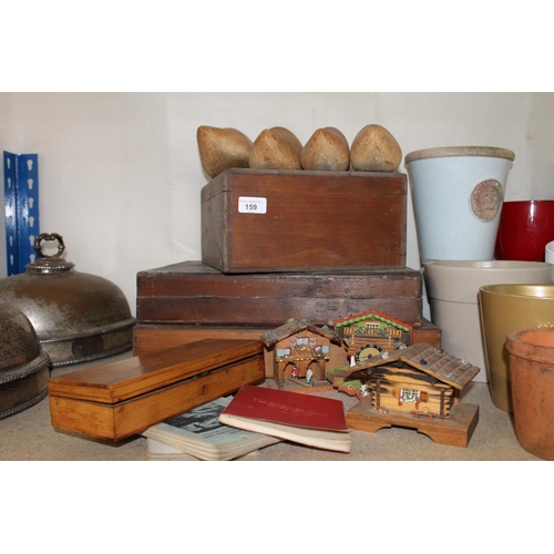 159 - Treen to include three hinge top boxes, two pairs of clogs, three Swiss chalet models, etc., and a b... 