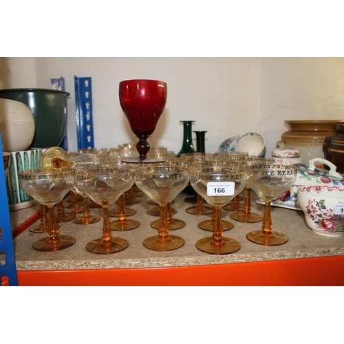 166 - Part suite of Czechoslovakian glass with gilt decoration, two green glass ewers, a cranberry glass g... 