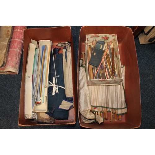 304 - Two boxes of antique knitting needles some in fabric binded sets.