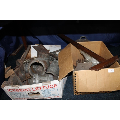 311 - Two boxes containing antique jelly moulds, tools, etc.