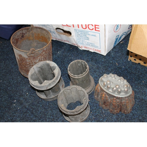 311 - Two boxes containing antique jelly moulds, tools, etc.