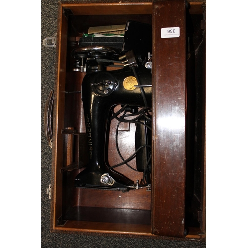 336 - Singer sewing machine in original case.