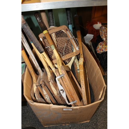 340 - Box containing vintage tennis rackets.