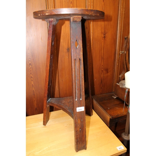 411 - Arts & Craft style oak occasional table of jardinière stand, raised on three pierced supports, 6... 