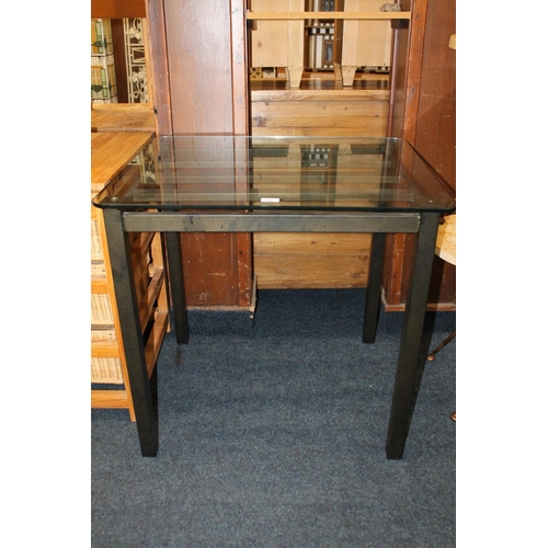 424 - Contemporary glass topped table raised on metal base, 76cm wide.