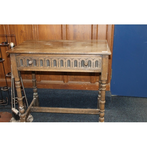 429 - Oak side table with frieze drawer, raised on turned supports, 76cm long.