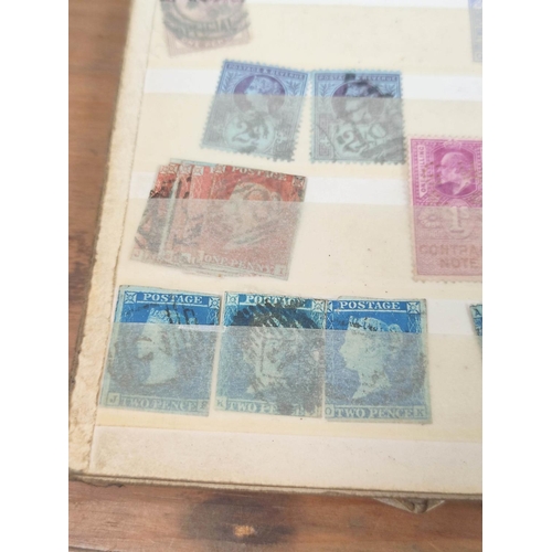 191 - Box of various curios to include postage stamp album sheets, three imperforated two penny blues, pen... 