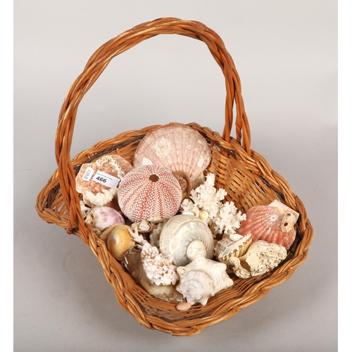 466 - Weaved basket containing variety of shells