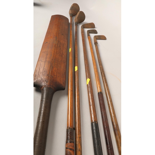 476 - Assorted hickory golf clubs and cricket bat