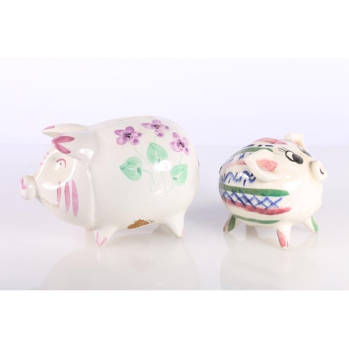 129 - Plichta pottery model of duck and two hand-painted pottery piggy banks.  (2)