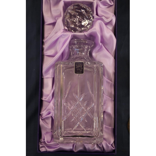 133 - Edinburgh Crystal cut-glass decanter of square section, in original box with stopper.