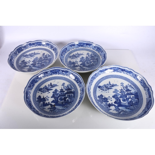 137 - Four Chinese blue and white dishes decorated with pavilion and garden scenes, 25cm and 23cm diameter... 