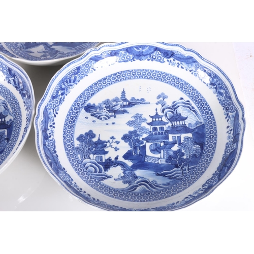 137 - Four Chinese blue and white dishes decorated with pavilion and garden scenes, 25cm and 23cm diameter... 