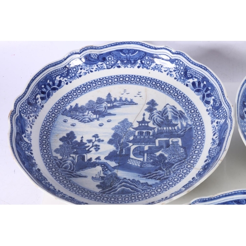 137 - Four Chinese blue and white dishes decorated with pavilion and garden scenes, 25cm and 23cm diameter... 