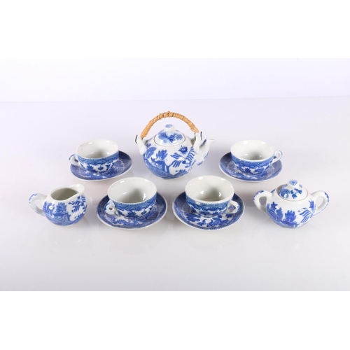 141 - Chinese style miniature blue and white toy china tea service in original box.